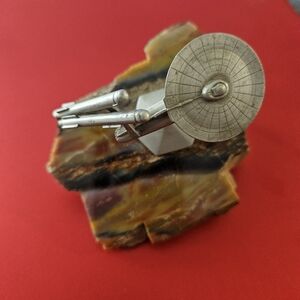Star Trek Raw Pewter on petrified wood.
